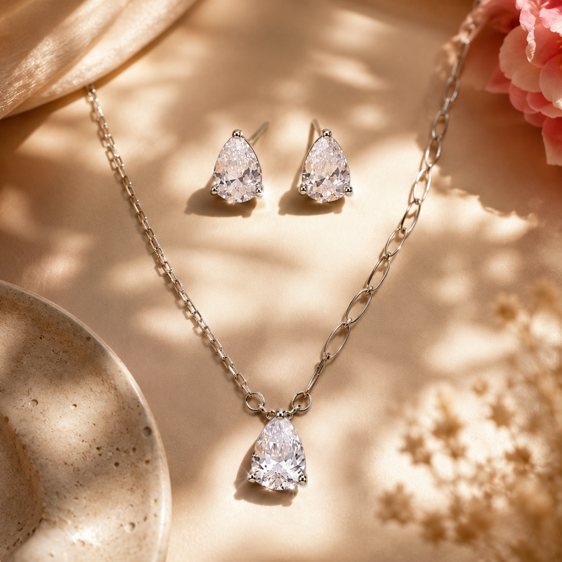 Elegant crystal pendant necklace with matching stud earrings