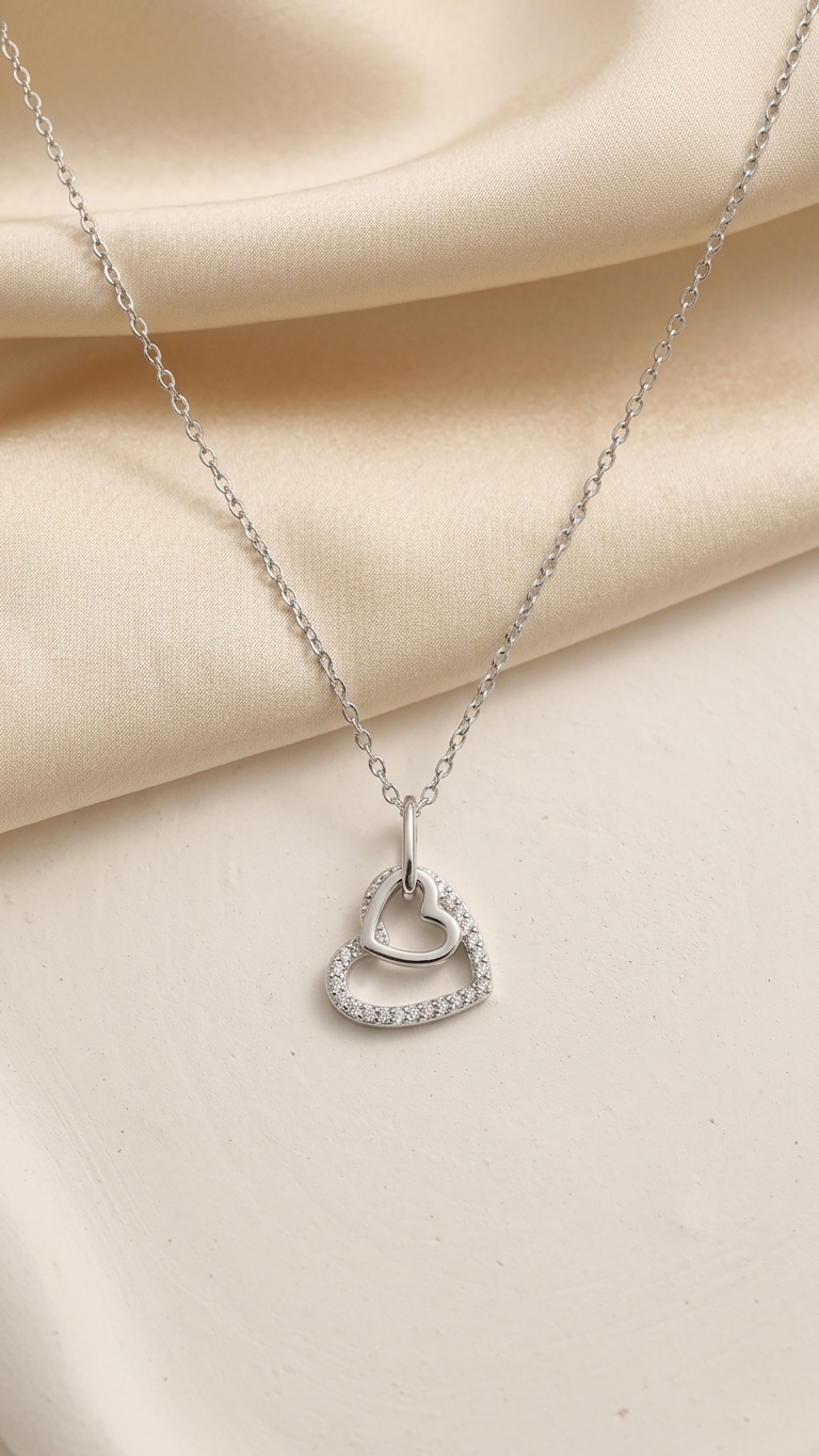 Fine silver chain featuring double heart halo pendant
