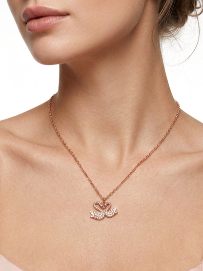 Female model wearing AANYA Twin Swan CZ Silver Pendant