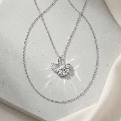 nature inspired ginkgo leaf silver pendant necklace on white stone background
925 sterling silver ginkgo leaf pendant necklace with cubic zirconia stones