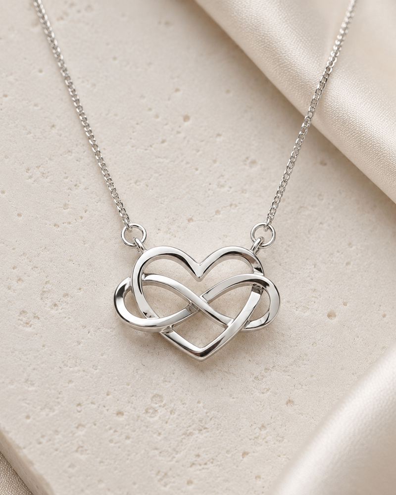 Close-up of Infinite Heart Halo Pendant showcasing CZ detailing and infinity motif