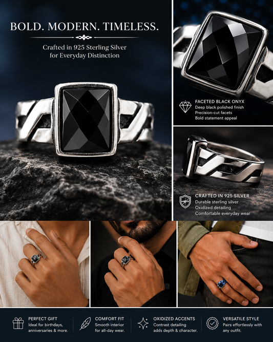 Silver ring with black gemstone on a dark background, shown on hands.