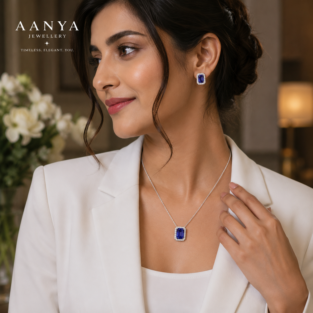 Luxury blue solitaire pendant styled with sophisticated formal wear